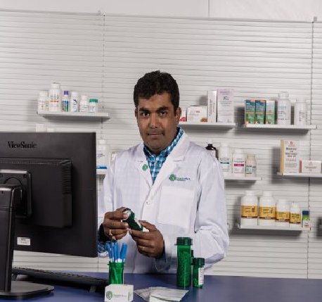 Ricker Pharmacy owner at the counter